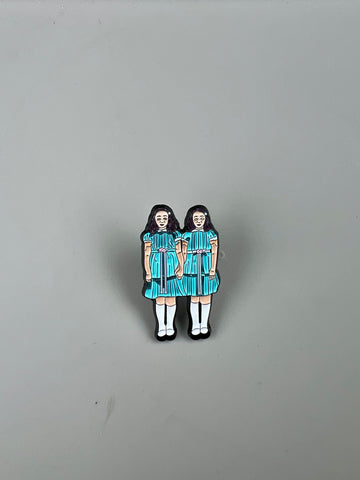 Shining twins pin